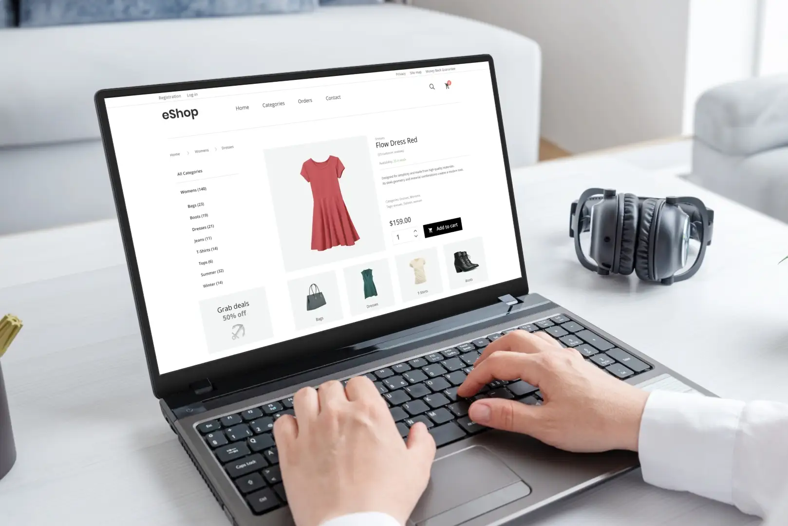 Laptop displaying an eCommerce website with a red dress for sale.