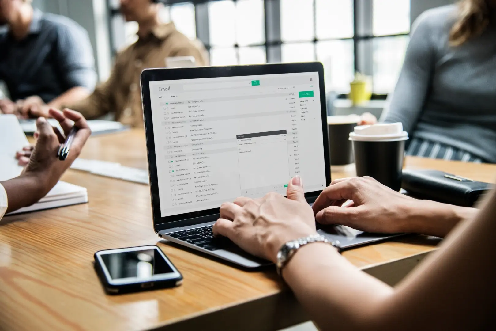 Mastering Email Marketing: Strategies and Tools for Success Hands typing on a laptop displaying an email inbox, representing email marketing.