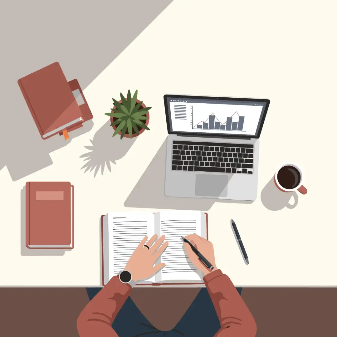 Expert Website Content Writing Services for Your Business Person writing in a notebook next to a laptop displaying charts, symbolizing website content writing.